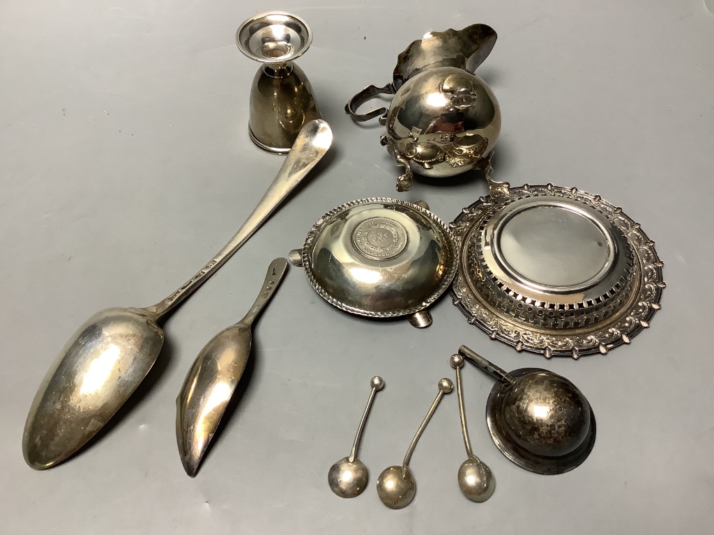 A small group of minor silver including 18th century silver tablespoon, Georgian silver cream jug, Georgian silver caddy spoon, egg cup, small dishes, etc. 9oz.